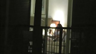 hotel Window voyeur, catches MILF playing