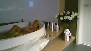 Amateur female is relaxing in the bath on hidden cam